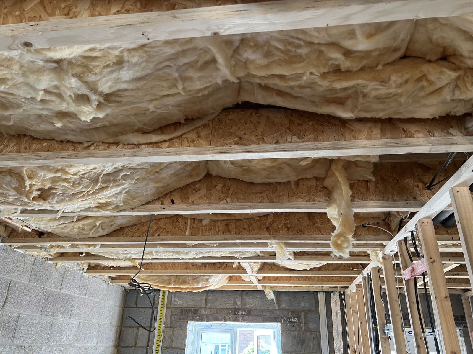 Timber stud walls and insulated ceiling inside an extension